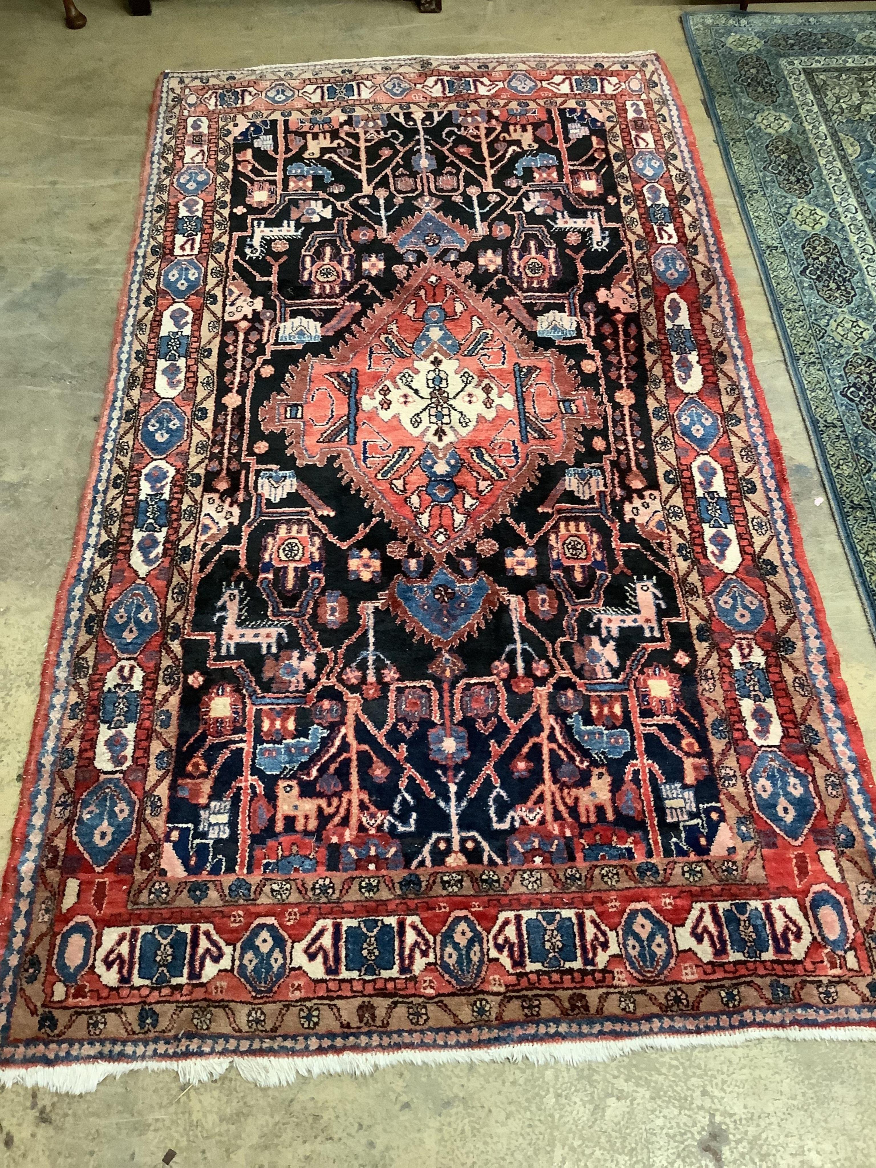 A North West Persian dark blue ground carpet, 306 x 168cm. Condition - good